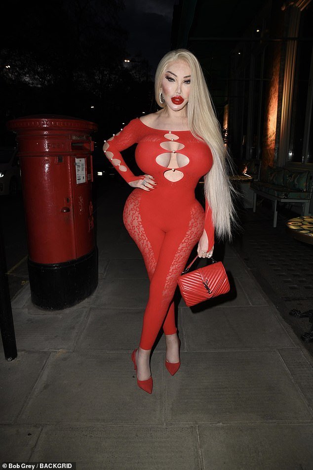 She amped up the red to the extreme by adding matching colored high heels and an Yves Saint Laurent bag