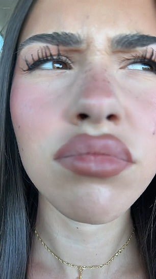 The TikTok video starts with a close-up of Leah's face;  she pouts and looks around before wrinkling her nose