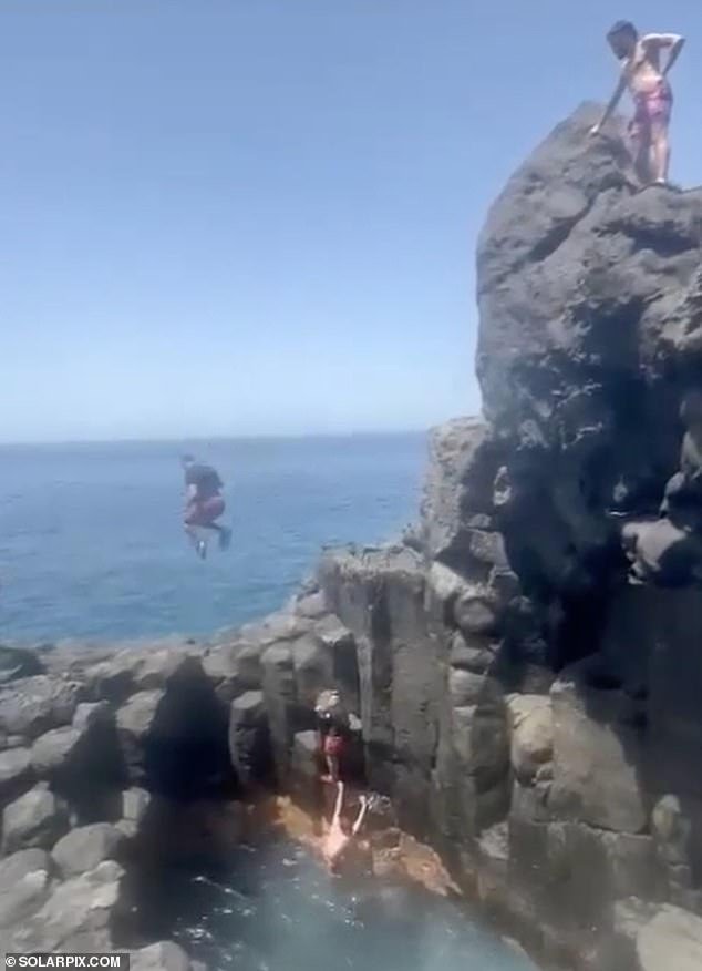 The man jumped too far, shot past the pool below and headed for the rock
