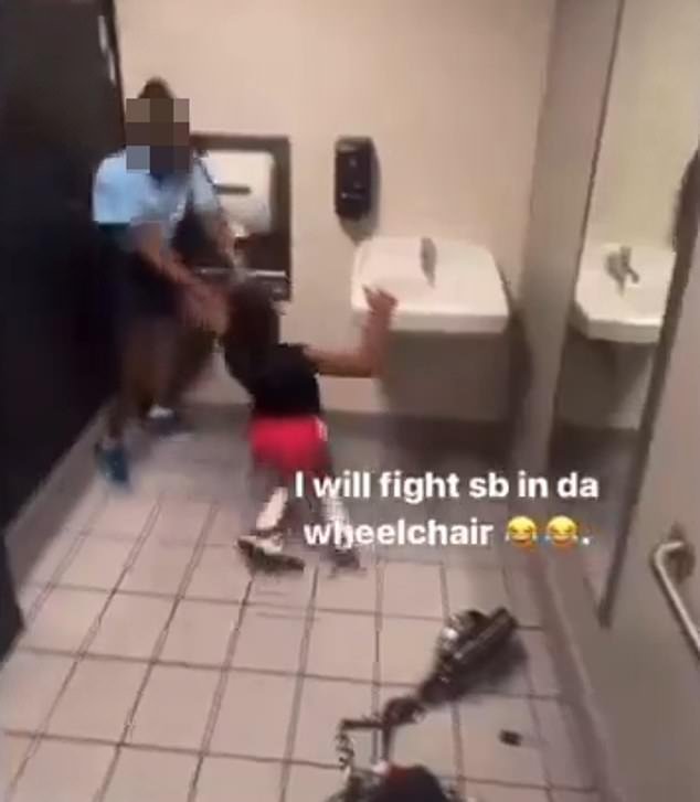 The disabled girl tries to get up and tries to retaliate, but the much larger attacker grabs her by the arm and swings her across the room.