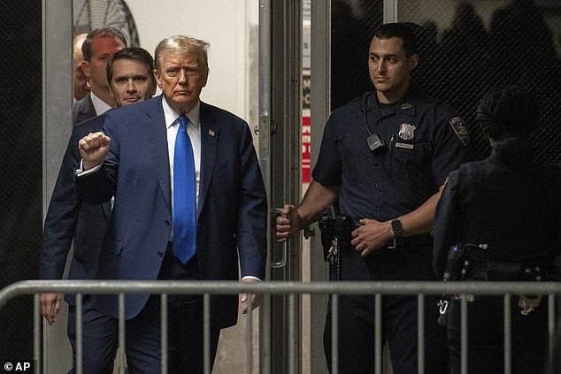 Trump raised a fist as he returned from a break at Manhattan Criminal Court on April 18