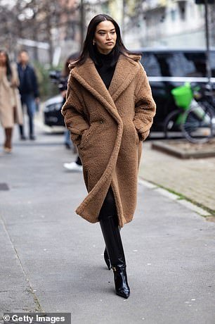 With its oversized fit and bear-like style, shoppers quickly dubbed the item a 'dupe' of Max Mara's teddy bear coat, priced at a whopping $6,150 (pictured)