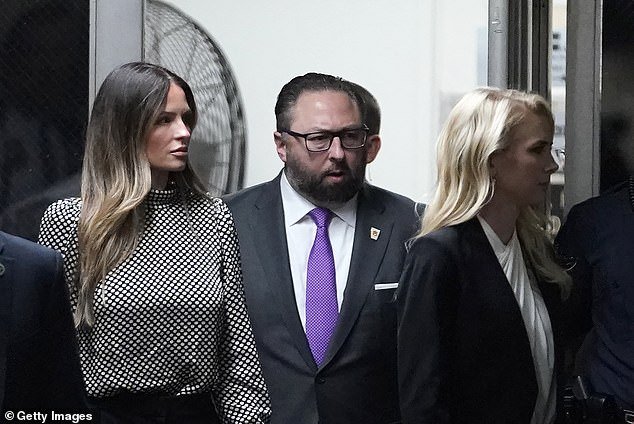 Trump aides Margo Martin (left), Jason Miller (center) and Natalie Harp (right) return to court in Manhattan after lunch on day three of jury selection in Trump's hush money case