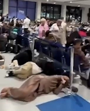 Footage from the airport - the world's busiest for international travel - showed passengers sleeping on the floor as they waited for flights abroad, after dozens were grounded following heavy rain