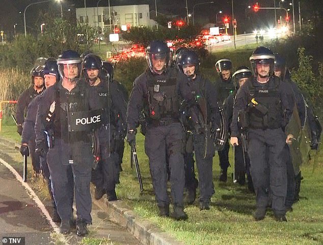 An angry crowd of thousands were involved in a series of intense clashes with police in Wakeley, near Fairfield, on Monday evening.  Officers were photographed at the scene