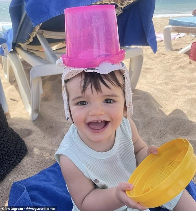 Then it was beach time and Otto laughed as he posed with a pink sandcastle bucket on his head and a shallow yellow bucket in his hands