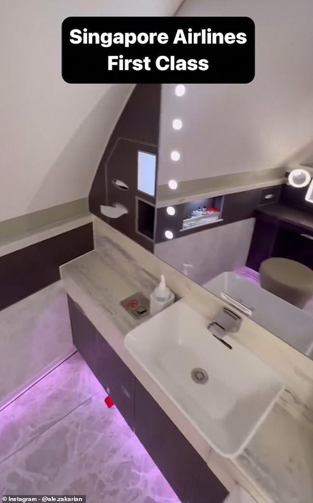 In the private bathroom, pink LED strip lighting sets the mood, while a Hollywood make-up mirror hangs above the sink and an array of toiletries are placed on a shelf