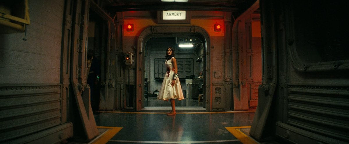 At the end of a hallway, Lucy (Ella Purnell) wears a bloody wedding dress in Fallout