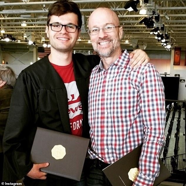 Doyel (right) is pictured next to one of his two sons after graduating