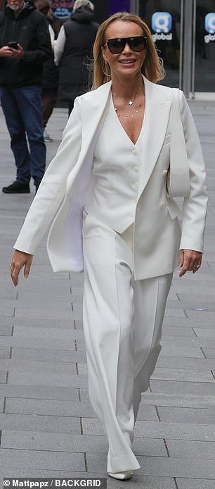 Amanda Holden, 53, looked effortlessly chic in an all-white power suit