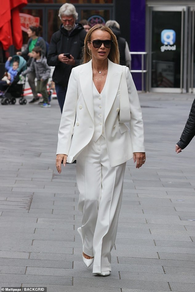 The TV star, who is preparing for the start of Britain's Got Talent on Saturday evening, kept it sophisticated in a waistcoat, fitted trousers and a double-breasted blazer from Reiss