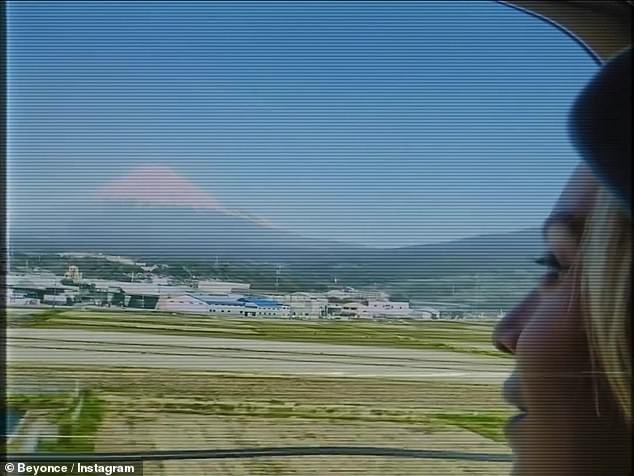 The 32-time Grammy winner posted a video of her, apparently captured by her husband of 16 years, as he admired her looking out the window on the train, taking in the remarkable volcano and sacred mountain in the distance.