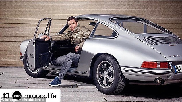Alonso behind the wheel of a classic Porsche during a photo shoot - he was nicknamed James Bond by the media in Spain