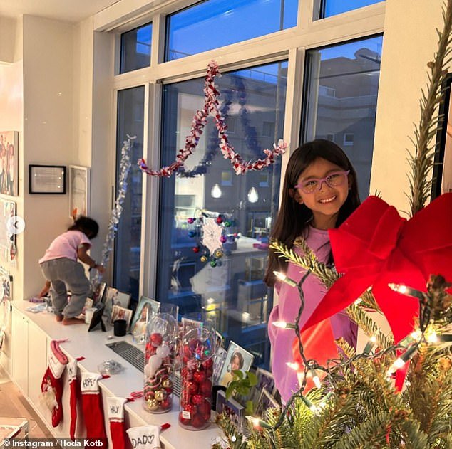 At Christmas, Hoda decorated her deep windowsills with ornaments and stockings while her daughters helped distribute tinsel from the window