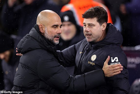 MANCHESTER, ENGLAND – FEBRUARY 17: Pep Guardiola, Manager of Manchester City, and Mauricio Pochettino, Manager of Chelsea, communicate ahead of the Premier League match between Manchester City and Chelsea FC at the Etihad Stadium on February 17, 2024 in Manchester, England.  (Photo by Catherine Ivill/Getty Images)