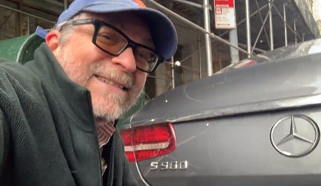 Gersh Kuntzman records himself repairing the license plate of a Mercedes in downtown Manhattan