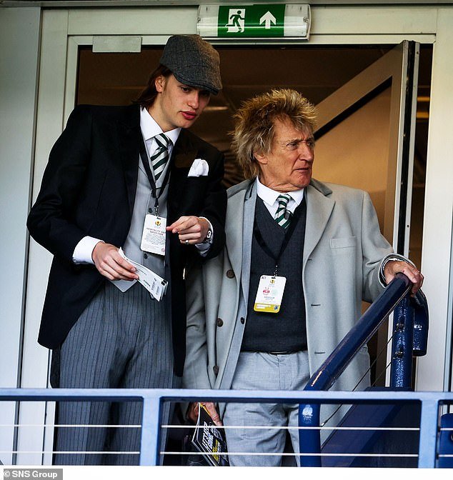 Rod suited up and dressed for the special occasion in one of his signature suits as he watched his club take on Aberdeen for a place in the final.