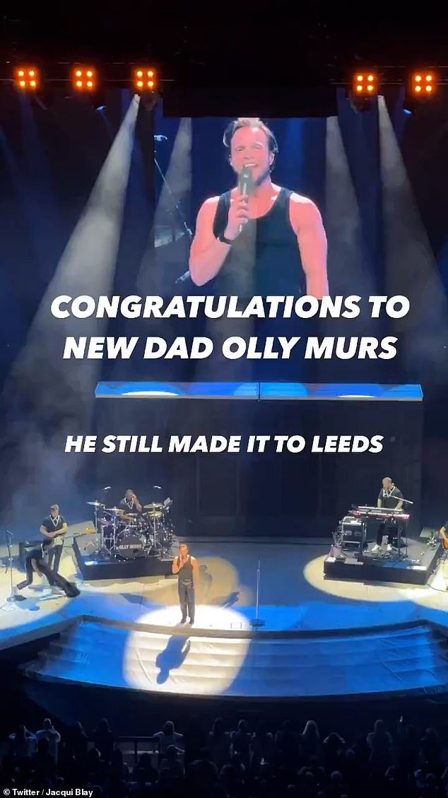 Olly took to the stage with Take That at the First Direct Arena in Leeds and announced: 'What's great about tonight is that it's my first show as a dad'