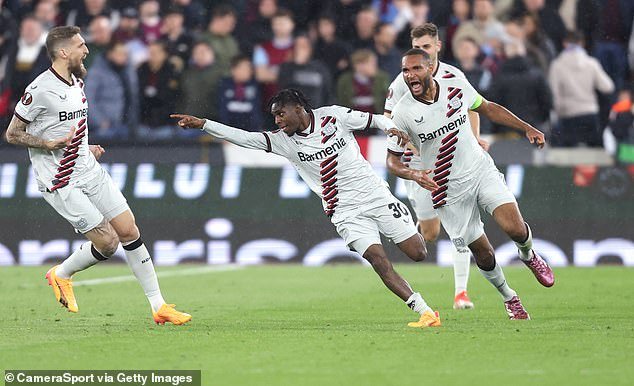 Jeremy Frimpong celebrates his late equalizer at West Ham to extend Leverkusen's unbeaten season to 44 games in all competitions