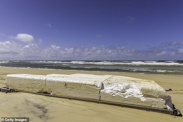 A huge piece of polystyrene washed up on a beach.  If one year's global production – 15.4 million tonnes – were divided into one-ton blocks, each would measure about three square meters.  In a row they would easily extend around the equator (stock image)