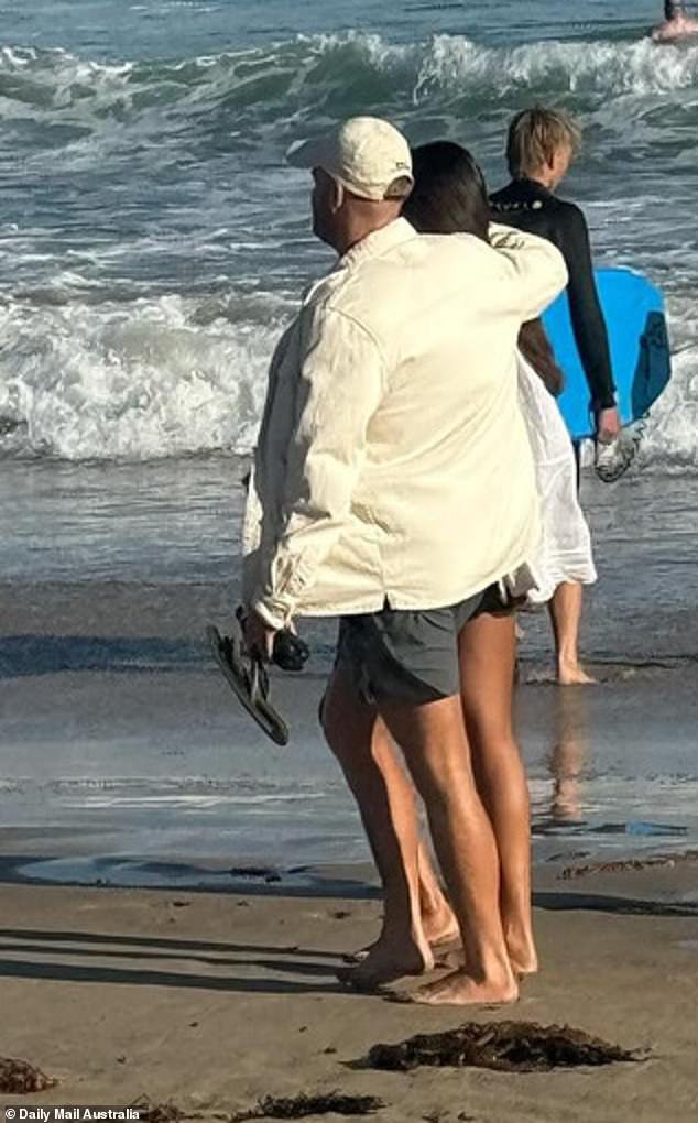 In photos taken by an eagle-eyed fan, the couple looked very happy as they walked hand-in-hand on the sand and gazed out to sea.