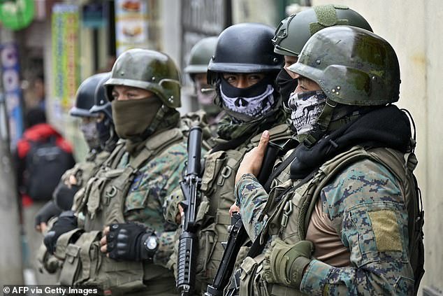 Soldiers supporting police stand guard outside El Inca prison in Quito on January 8, 2024