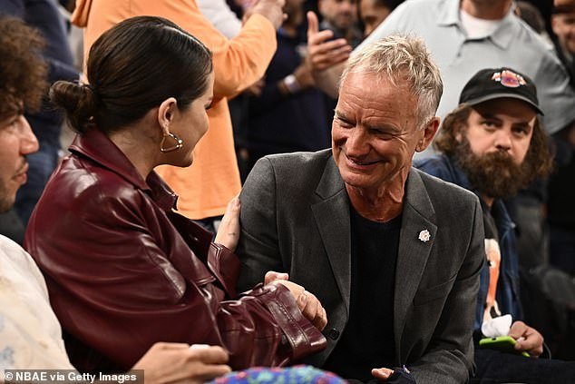 The couple looked in good spirits as they sat courtside next to musician Sting who chatted with Selena during the match
