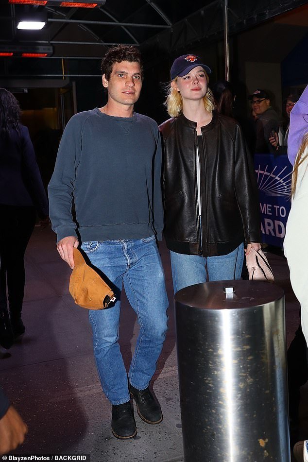 Elle Fanning attended the game with her boyfriend Gus Wenner and opted for a black jacket with a white top and blue jeans