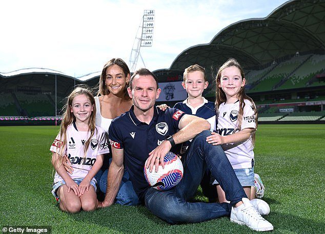 Broxham poses with his young family after announcing his retirement on Tuesday