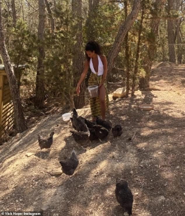 The beauty shared some candid snaps as she fed the chickens and couldn't wipe the smile off her face