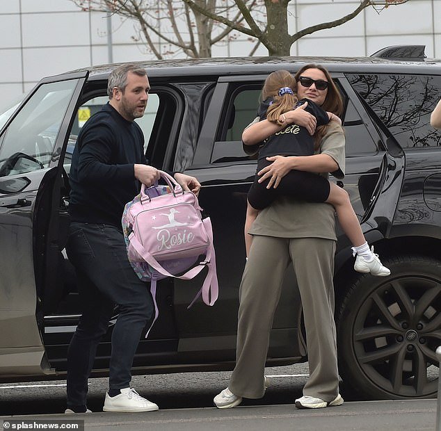 The former TOWIE star, 33, gave Paul Knightley an awkward kiss on the cheek after they arrived at the airport and hugged her eldest children Paul, seven, and Rosie, five, a hug goodbye
