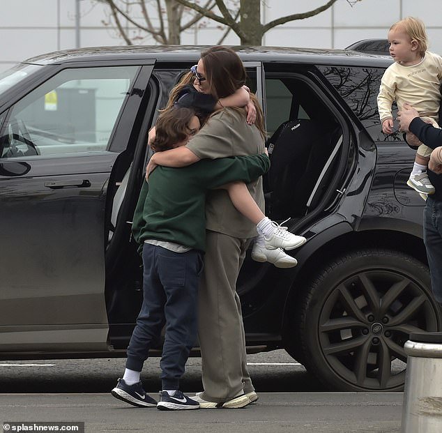 Sam looked emotional as she gave her eldest children a goodbye hug