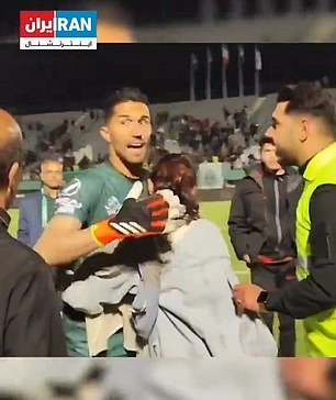 Footage showed the goalkeeper hugging a female fan whose hijab had fallen off her head