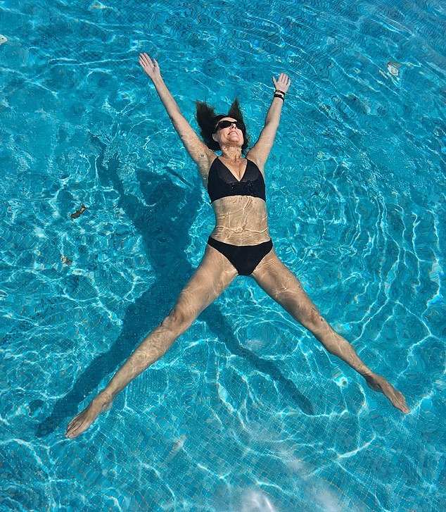 Floating on her back in the pool, Bev showed off her washboard abs and it's clear that even on holiday she doesn't drop her fitness regime and still makes sure she gets in her gym session.