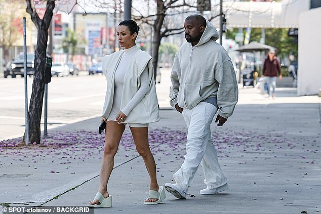 The 46-year-old rapper wore a cream-colored hoodie, paired with baggy sweats, and flashed his gray underwear as he strolled alongside his wife, 29, in LA