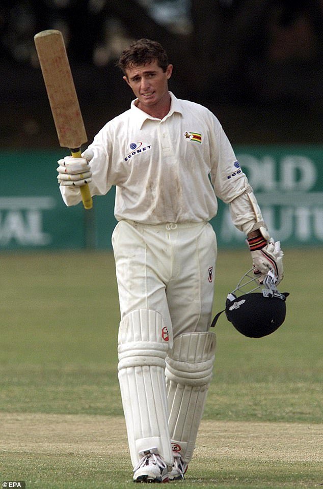 Zimbabwean batsman Guy Whittall celebrates after scoring his fourth Test century in 2001