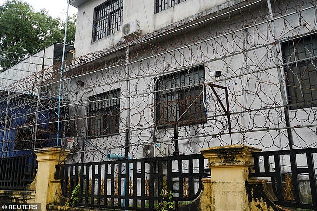 Former cyber slaves have revealed the horrors they experienced as they were trafficked by Chinese gangs and forced to run online scams in barbed wire-covered buildings in South Asia.  Pictured is a complex in Cambodia that was closed by officials