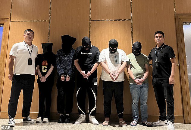 China's Ministry of Public Security last year arrested hundreds of criminals (photo) who trafficked people in online scams