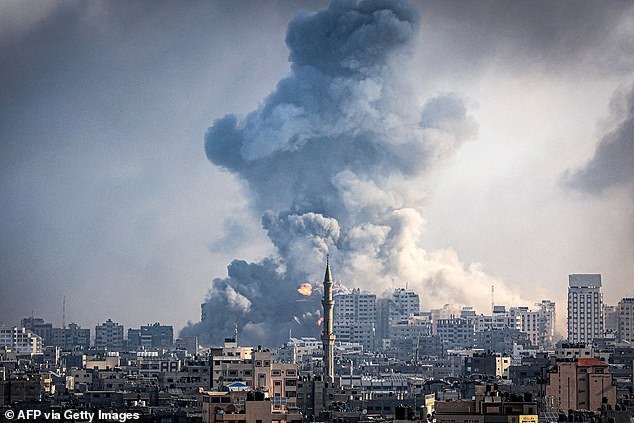 Plumes of smoke rise during Israeli airstrikes in Gaza City on October 12, 2023