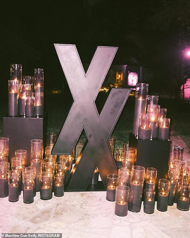 Decorations at the event included black candles and two large XXs