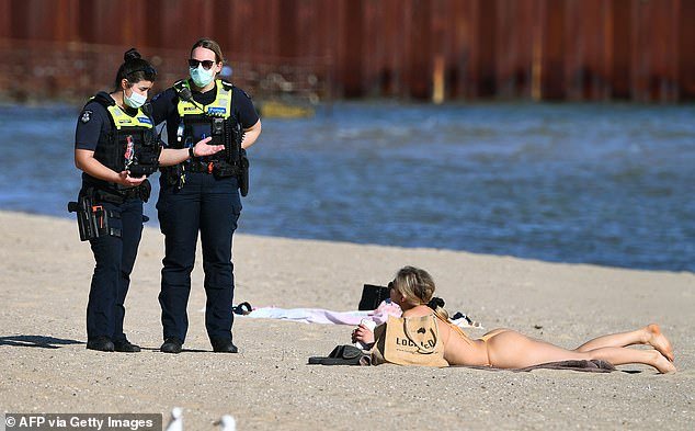 Going to the beach was illegal during Victoria's lockdowns (photo in St Kilda in 2021)