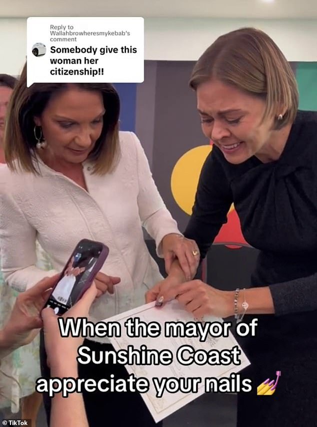 Even Sunshine Coast Mayor Rosanna Natoli (left), who was the presiding officer at the citizenship ceremony, was impressed with Mila's manicure
