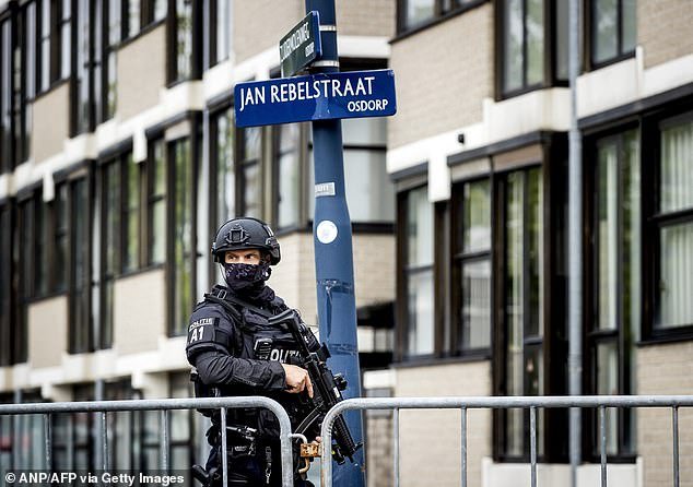 Security personnel stand guard outside the court bunker in Amsterdam-Osdorp for a hearing where Dutch drug lord Ridouan Taghi of Mocro Mafia was given a life sentence