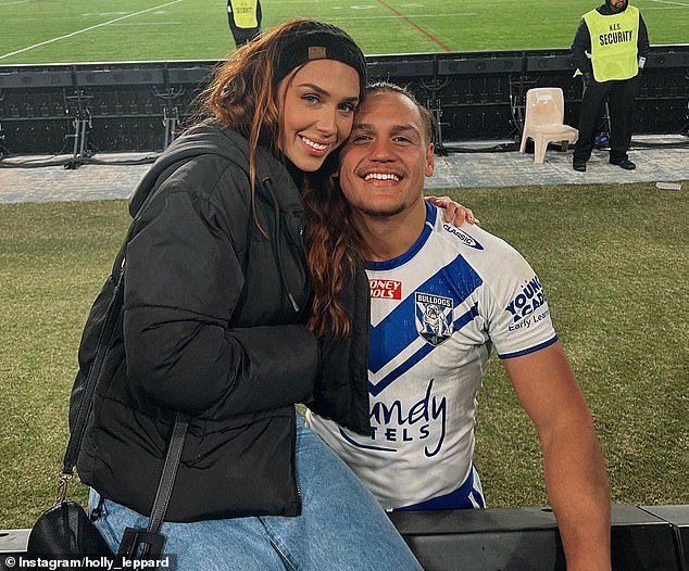 Topine (pictured with girlfriend Holly Leppard) believes he was subjected to 'unlawful corporal punishment', humiliation, fear, anxiety and 'deprivation of liberty' during a heavy wrestling session last July