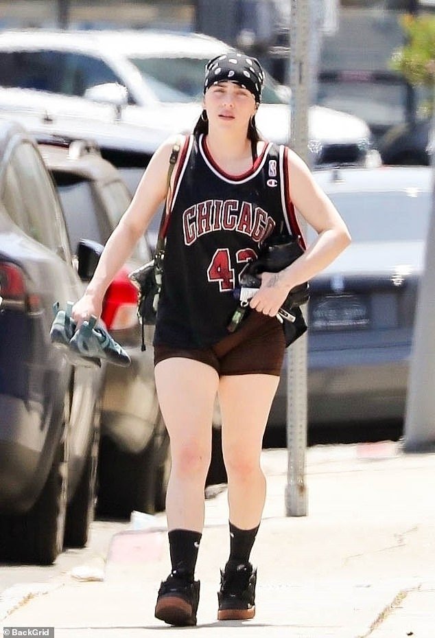 What was I made for?  singer wore a Chicago Bulls jersey and biker shorts