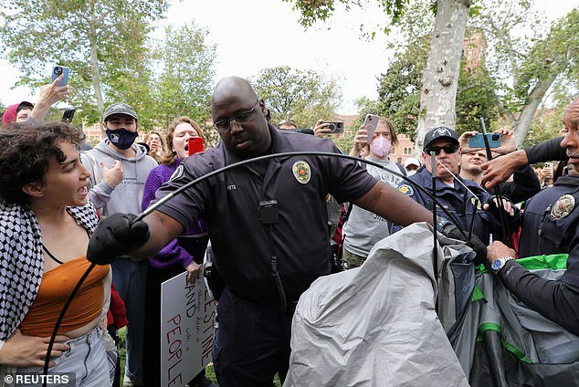 USC security officials try to disperse pro-Palestinian protesters and take down tents