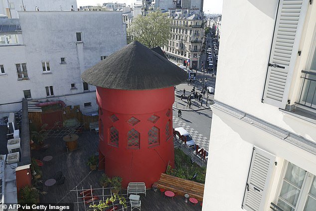 The red tower atop Paris' famous monument is seen without sails today after the incident