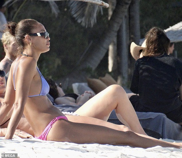 The Puerto Rican model looked stunning in a strappy bikini top and pink bottoms as she sunbathed on the sand