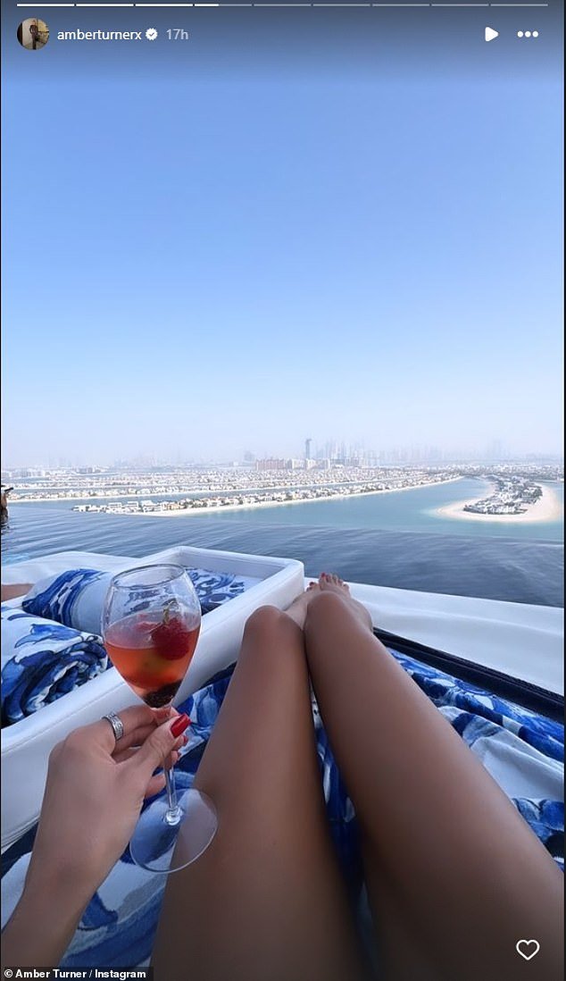 Amber, 30, spent her Wednesday at a rooftop bar.  Amber shared a photo of her incredible view as she sat back hard with a drink