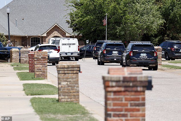The scene outside the Candy family home.  Neighbor Brian Graham told KFOR: 'No one expected this, it was very shocking.  You know, like I said, it was a great family.